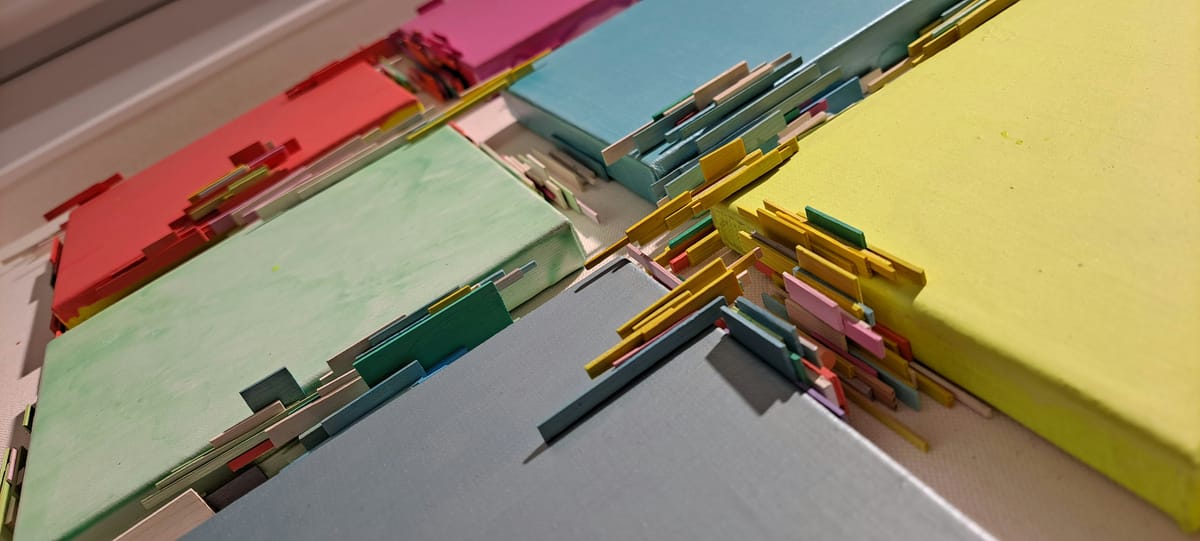 a bunch of different colored papers on a table